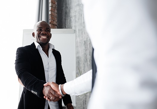 Two business men shaking hands